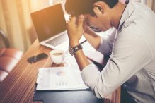 tired man working at desk