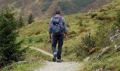 middle aged man enjoying mountain hike